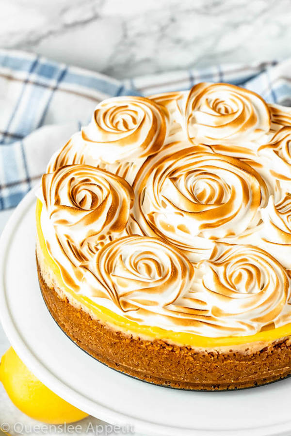 graham cracker crust, lemon cheesecake, lemon curd topping, meringue rosettes