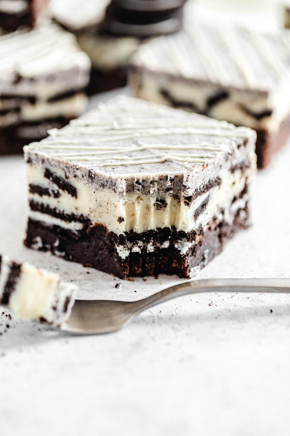 close up of brownie with fork bite taken out and fork in front of it