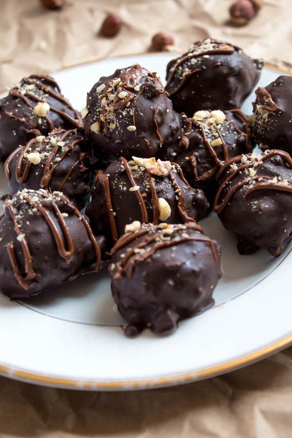 Delectable chocolate hazelnut truffles with an irresistibly smooth Nutella center. These melt-in-your-mouth Nutella Truffles are an upgrade from eating spoonfuls of Nutella straight from the jar!