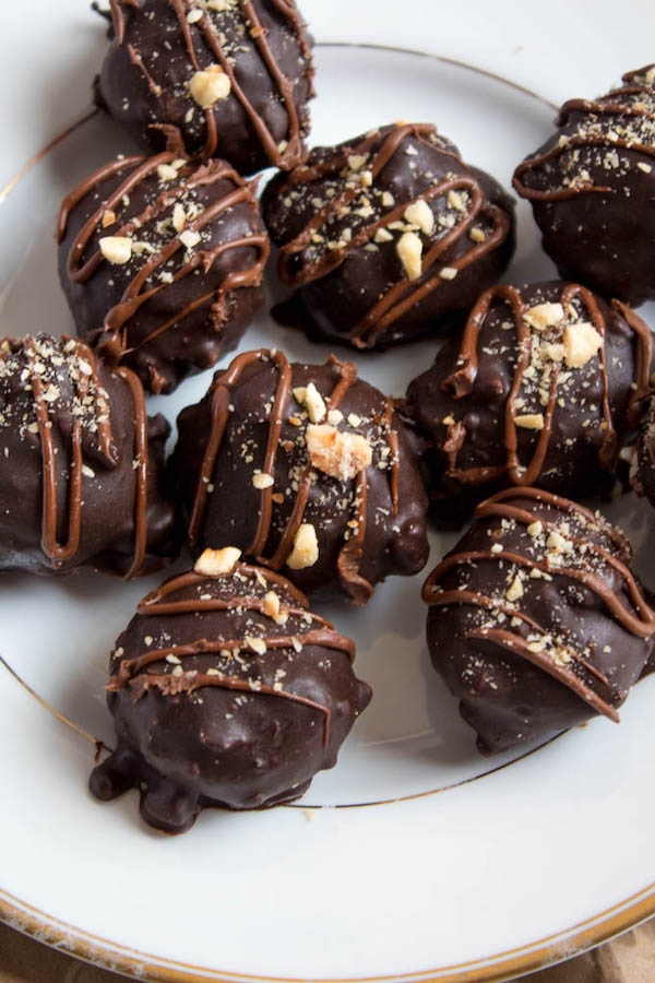 Delectable chocolate hazelnut truffles with an irresistibly smooth Nutella center. These melt-in-your-mouth Nutella Truffles are an upgrade from eating spoonfuls of Nutella straight from the jar!