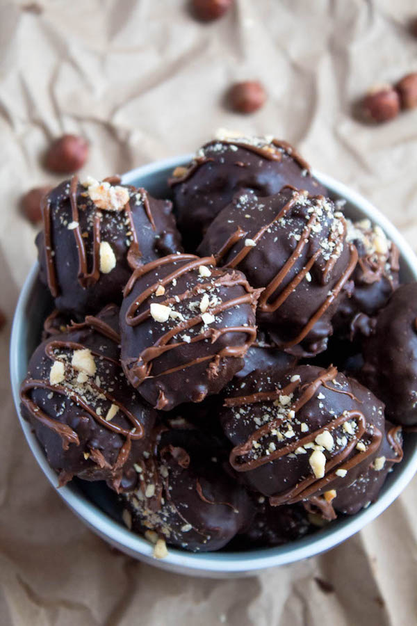 Delectable chocolate hazelnut truffles with an irresistibly smooth Nutella center. These melt-in-your-mouth Nutella Truffles are an upgrade from eating spoonfuls of Nutella straight from the jar!