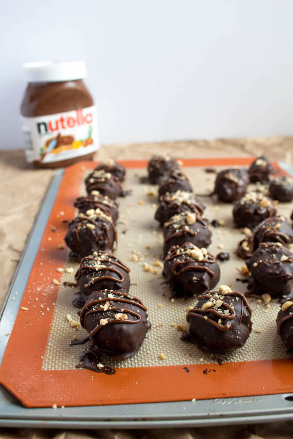 Delectable chocolate hazelnut truffles with an irresistibly smooth Nutella center. These melt-in-your-mouth Nutella Truffles are an upgrade from eating spoonfuls of Nutella straight from the jar!