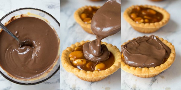 Mini Salted Caramel Snickers Tarts! Mini pre-baked tart shells with a salted caramel peanut filling and a chocolate peanut butter topping. Finish it off with chopped snickers and more peanuts, and you have the easiest/most decadent and delicious, bite-sized dessert!