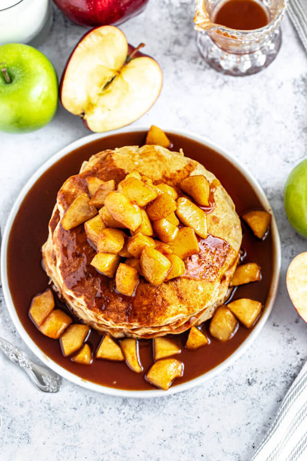 apple cinnamon pancakes topped with maple cinnamon apple topping