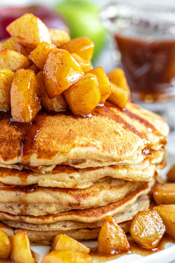 apple cinnamon pancakes topped with maple cinnamon apple topping