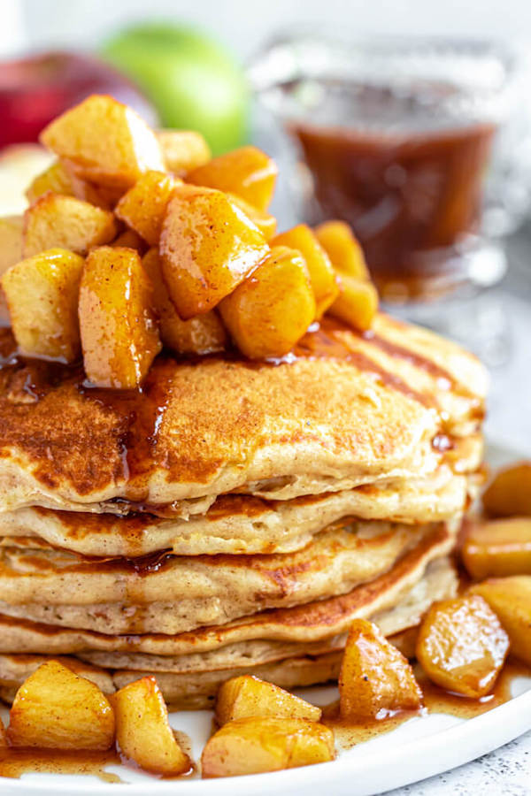 apple cinnamon pancakes topped with maple cinnamon apple topping
