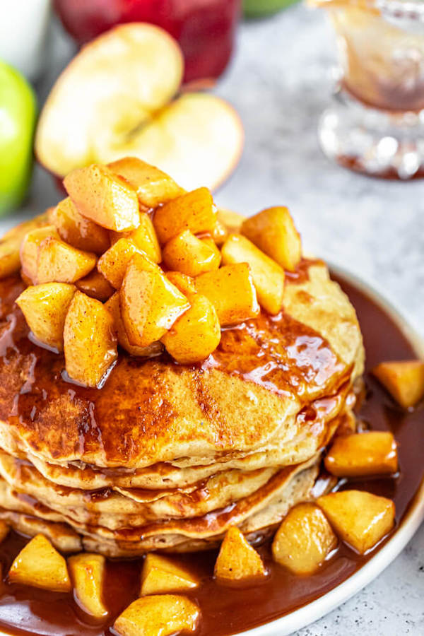 apple cinnamon pancakes topped with maple cinnamon apple topping