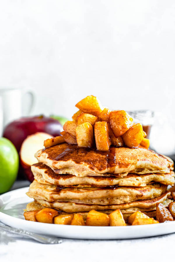 apple cinnamon pancakes topped with maple cinnamon apple topping