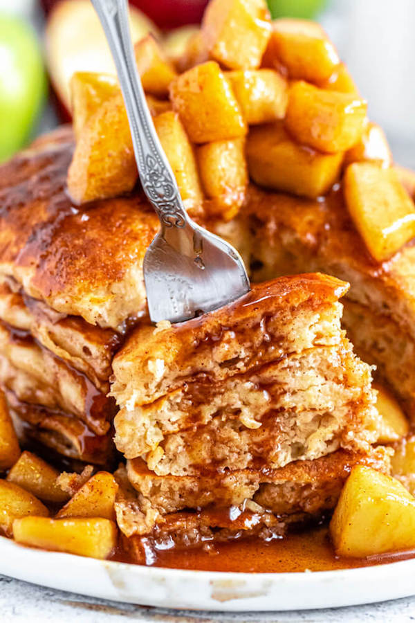 apple cinnamon pancakes topped with maple cinnamon apple topping