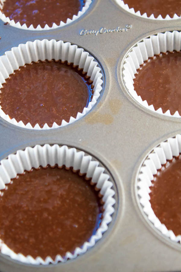 These Chocolate Cupcakes are perfectly moist, fluffy and full of rich chocolate flavour! Topped with a silky and dreamy Chocolate Buttercream Frosting - these cupcakes are the perfect treat for chocoholics.