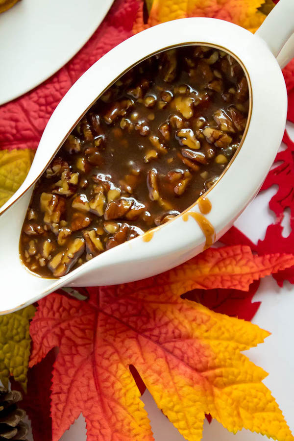 These Pumpkin Pancakes are light, fluffy and has the perfect amount of pumpkin and spice flavour! Topped with a rich and delicious Maple Pecan Praline Syrup, these irresistible pancakes are the perfect fall breakfast!