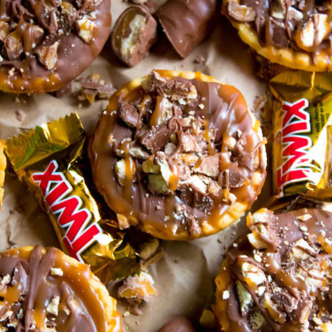 These Mini Twix Tarts taste just like a Twix bar! Mini pre-baked tart shells filled with homemade caramel sauce and topped with milk chocolate and chopped Twix bars. If you love Twix candy bars then this is the perfect treat for you!