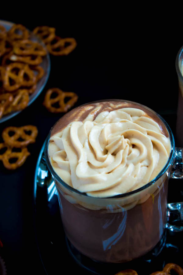 This quick and easy Peanut Butter Hot Chocolate tastes just like a peanut butter cup in liquid form! Top it off with peanut butter whipped cream, chopped peanut butter cups, and a drizzle of chocolate sauce and melted peanut butter for the ultimate PB and Chocolate drink!