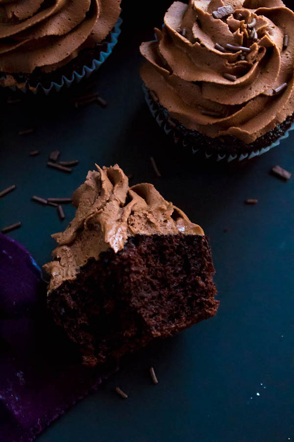 These Chocolate Cupcakes are perfectly moist, fluffy and full of rich chocolate flavour! Topped with a silky and dreamy Chocolate Buttercream Frosting - these cupcakes are the perfect treat for chocoholics.