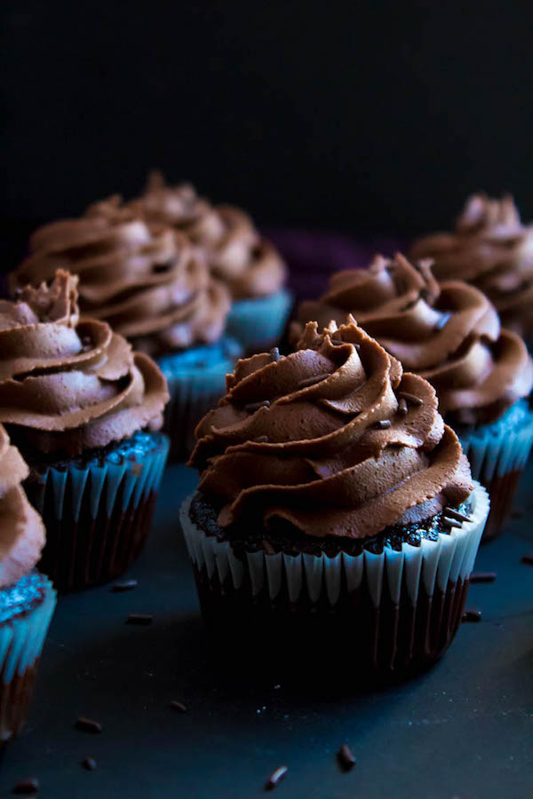 These Chocolate Cupcakes are perfectly moist, fluffy and full of rich chocolate flavour! Topped with a silky and dreamy Chocolate Buttercream Frosting - these cupcakes are the perfect treat for chocoholics.