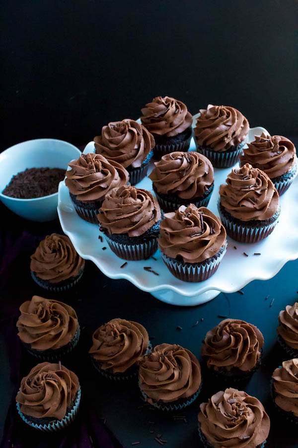 These Chocolate Cupcakes are perfectly moist, fluffy and full of rich chocolate flavour! Topped with a silky and dreamy Chocolate Buttercream Frosting - these cupcakes are the perfect treat for chocoholics.