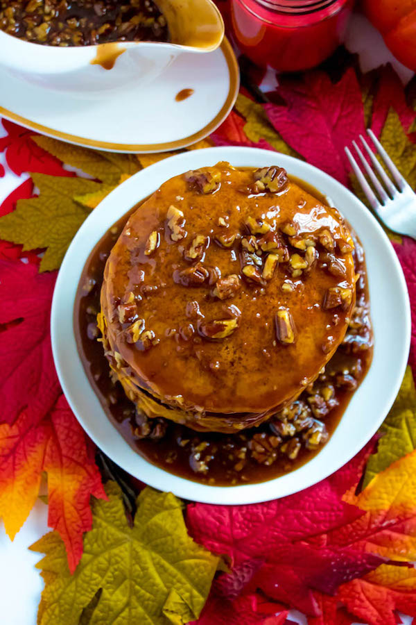 These Pumpkin Pancakes are light, fluffy and has the perfect amount of pumpkin and spice flavour! Topped with a rich and delicious Maple Pecan Praline Syrup, these irresistible pancakes are the perfect fall breakfast!