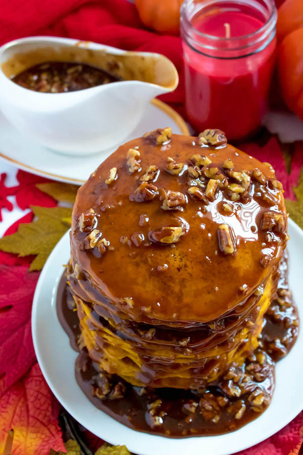 These Pumpkin Pancakes are light, fluffy and has the perfect amount of pumpkin and spice flavour! Topped with a rich and delicious Maple Pecan Praline Syrup, these irresistible pancakes are the perfect fall breakfast!