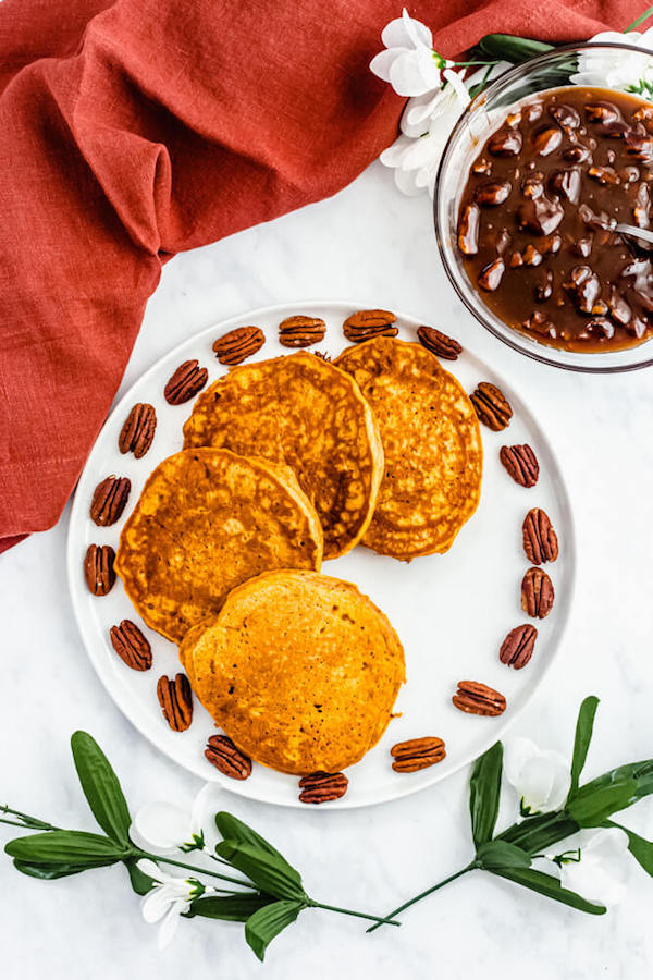 pumpkin pancakes surrounded by pecans