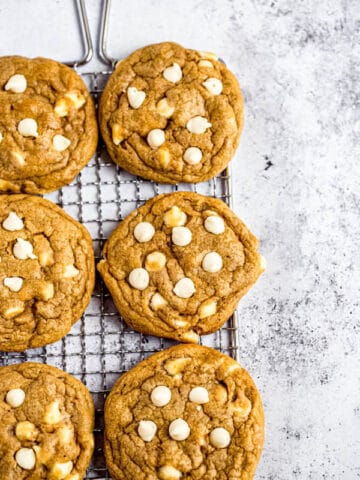 white chocolate chip pumpkin cookies on a safety grater