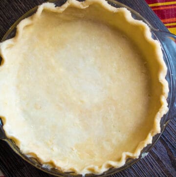 This pie crust is flaky, delicious and so easy to make. Whether you have a Food Processor or not, you can easily make a perfect pie crust that'll make all your homemade pies taste amazing!