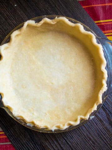 This pie crust is flaky, delicious and so easy to make. Whether you have a Food Processor or not, you can easily make a perfect pie crust that'll make all your homemade pies taste amazing!