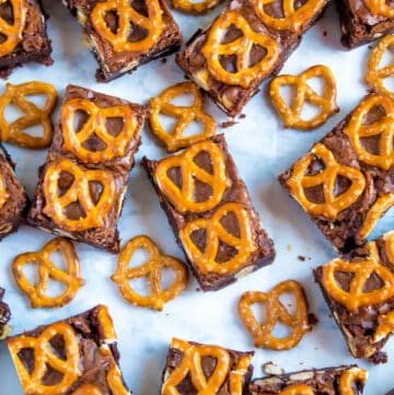 Salty meets sweet in these Nutella Pretzel Brownies! A perfectly fudgy Nutella brownie with roasted hazelnuts and salty pretzels mixed in. This decadent dessert will satisfy all of your salty and sweet cravings!