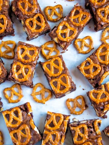 Salty meets sweet in these Nutella Pretzel Brownies! A perfectly fudgy Nutella brownie with roasted hazelnuts and salty pretzels mixed in. This decadent dessert will satisfy all of your salty and sweet cravings!
