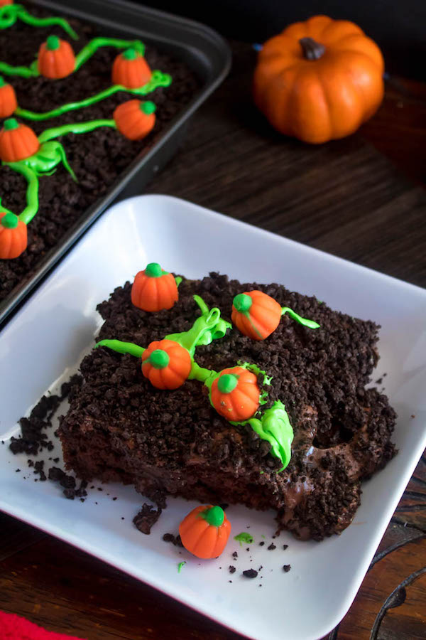 This Pumpkin Patch Poke Cake is super fun, easy and festive! This cute dessert would be a great treat to serve after Thanksgiving dinner!