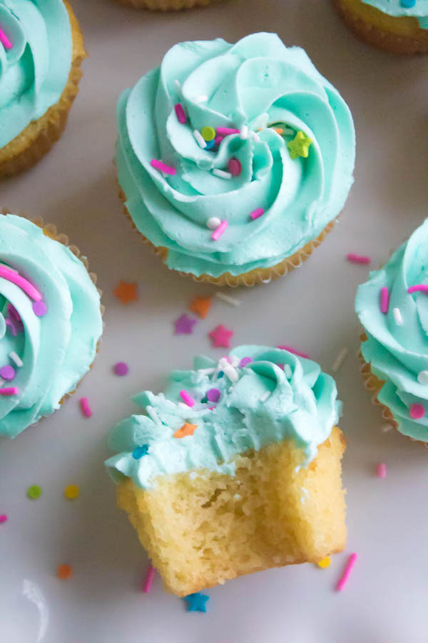 These Vanilla Cupcakes are light, fluffy and incredibly moist! Topped with a creamy and Dreamy Vanilla Buttercream, these are the best cupcakes for a birthday party or any event!
