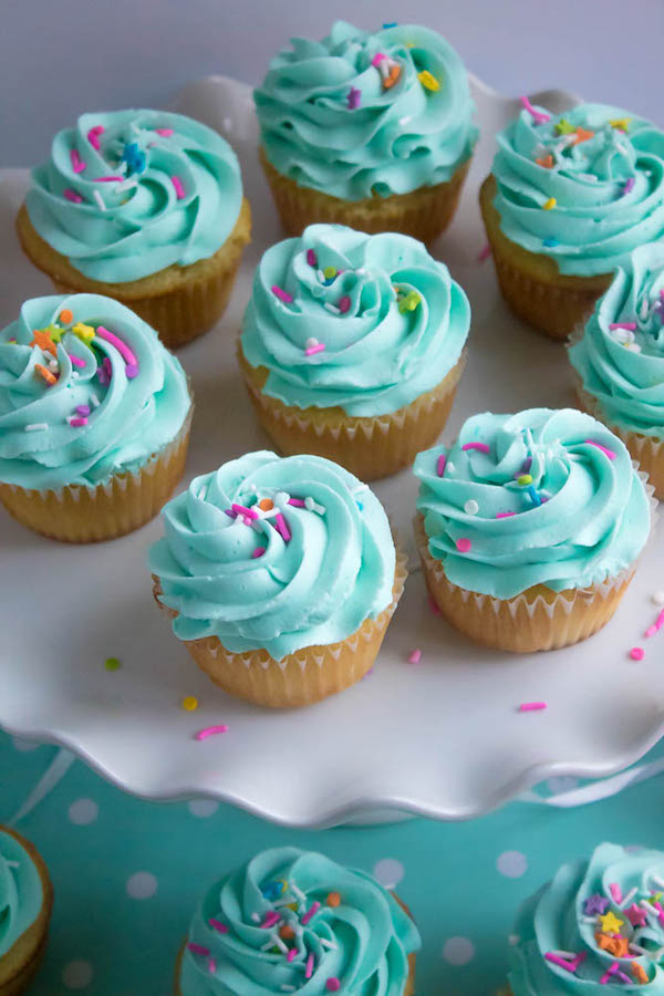 These Vanilla Cupcakes are light, fluffy and incredibly moist! Topped with a creamy and Dreamy Vanilla Buttercream, these are the best cupcakes for a birthday party or any event!