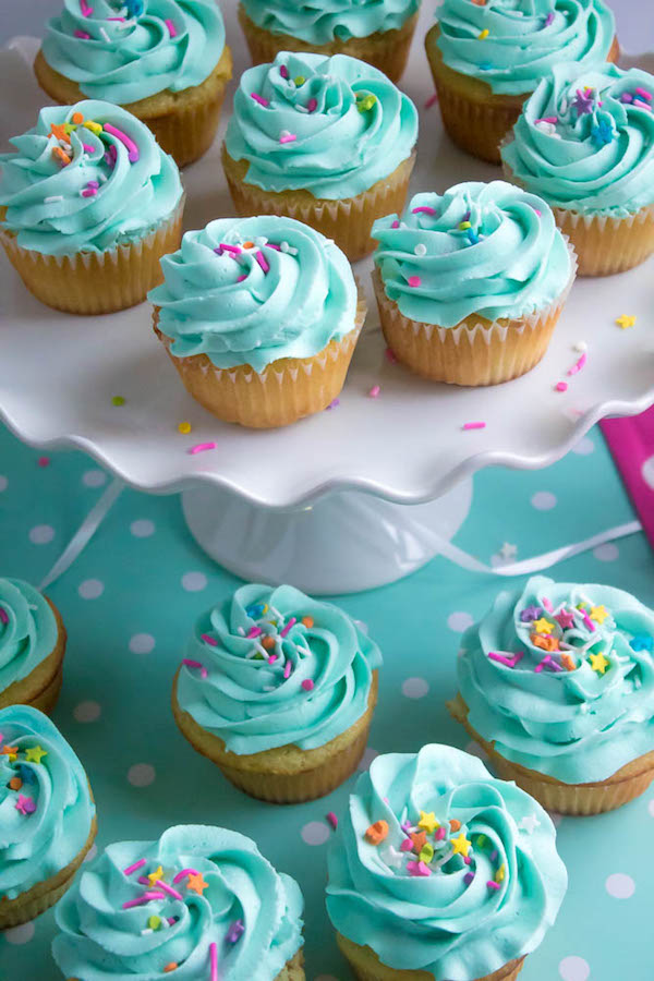 These Vanilla Cupcakes are light, fluffy and incredibly moist! Topped with a creamy and Dreamy Vanilla Buttercream, these are the best cupcakes for a birthday party or any event!