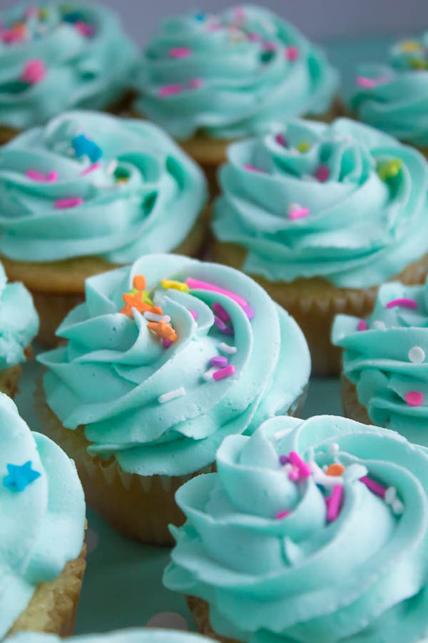 These Vanilla Cupcakes are light, fluffy and incredibly moist! Topped with a creamy and Dreamy Vanilla Buttercream, these are the best cupcakes for a birthday party or any event!