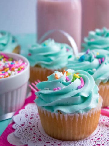 These Vanilla Cupcakes are light, fluffy and incredibly moist! Topped with a creamy and Dreamy Vanilla Buttercream, these are the best cupcakes for a birthday party or any event!