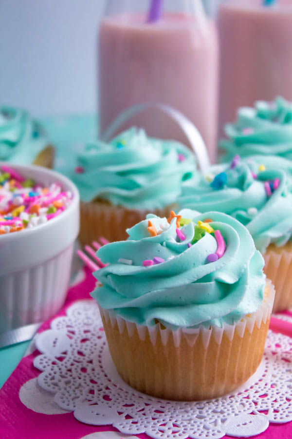 These Vanilla Cupcakes are light, fluffy and incredibly moist! Topped with a creamy and Dreamy Vanilla Buttercream, these are the best cupcakes for a birthday party or any event!