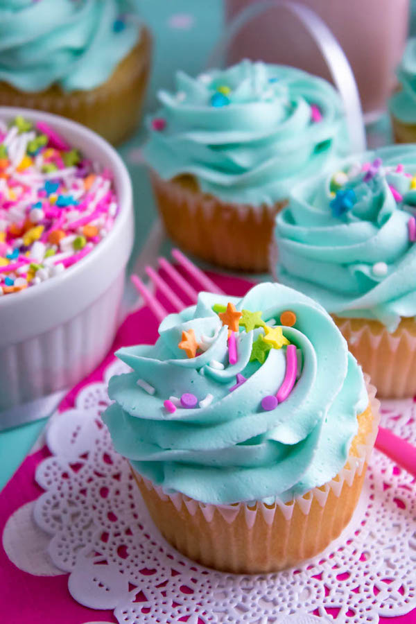 These Vanilla Cupcakes are light, fluffy and incredibly moist! Topped with a creamy and Dreamy Vanilla Buttercream, these are the best cupcakes for a birthday party or any event!