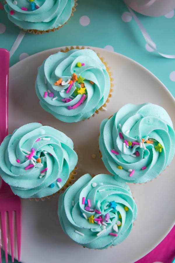 These Vanilla Cupcakes are light, fluffy and incredibly moist! Topped with a creamy and Dreamy Vanilla Buttercream, these are the best cupcakes for a birthday party or any event!