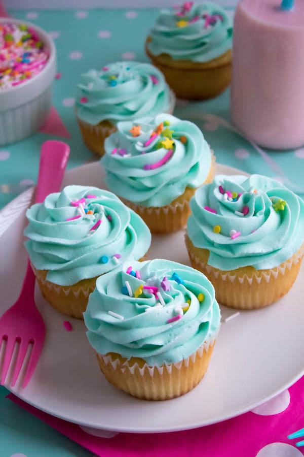 These Vanilla Cupcakes are light, fluffy and incredibly moist! Topped with a creamy and Dreamy Vanilla Buttercream, these are the best cupcakes for a birthday party or any event!