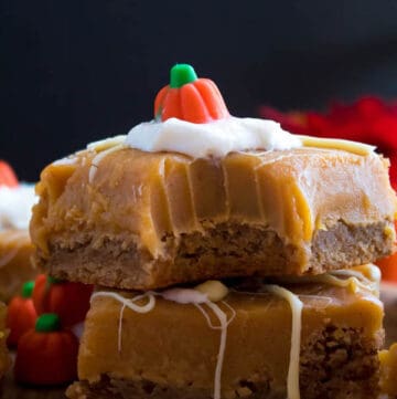 These White Chocolate Pumpkin Spice Fudge Blondies consist of a spiced blondie and white chocolate pumpkin spice fudge on top! These delicious pumpkin bars are the perfect treat for fall and Thanksgiving!