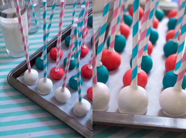 These Gender Reveal Cake Pops are a fun and cute way to surprise your baby shower guests! Once they bite into it, the pink or blue cake inside will reveal if it's a boy or girl!