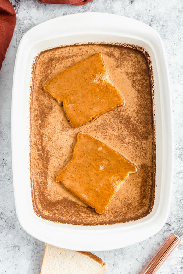 soaking Texas toast in pumpkin French toast mixture