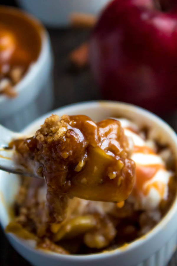 Salted Caramel Apple Crisp – Fresh apples, tossed with sugar and spices, blanketed under a layer of salted caramel sauce and topped with a crispy oatmeal-pecan crumble! This salty and sweet treat is the perfect dessert for Fall and Thanksgiving!