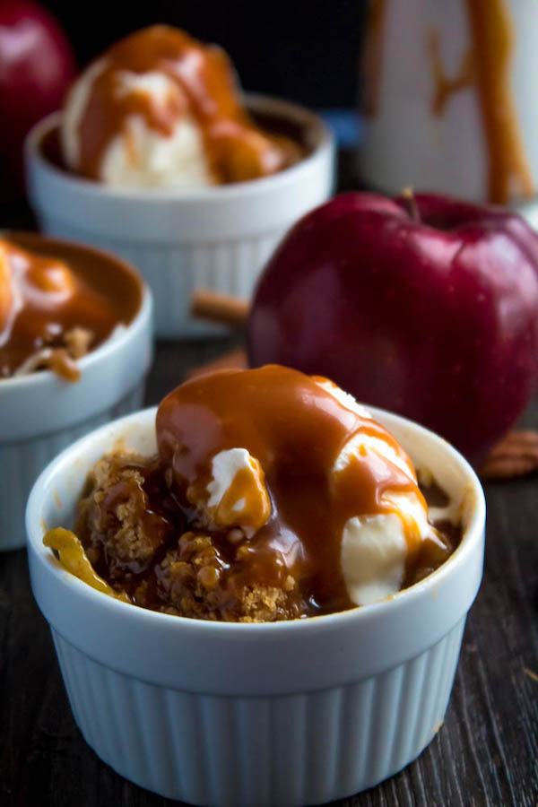 Salted Caramel Apple Crisp – Fresh apples, tossed with sugar and spices, blanketed under a layer of salted caramel sauce and topped with a crispy oatmeal-pecan crumble! This salty and sweet treat is the perfect dessert for Fall and Thanksgiving!