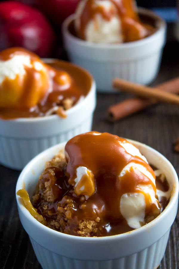 Salted Caramel Apple Crisp – Fresh apples, tossed with sugar and spices, blanketed under a layer of salted caramel sauce and topped with a crispy oatmeal-pecan crumble! This salty and sweet treat is the perfect dessert for Fall and Thanksgiving!