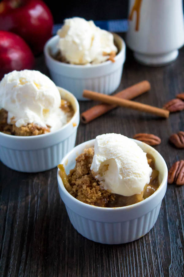 Salted Caramel Apple Crisp – Fresh apples, tossed with sugar and spices, blanketed under a layer of salted caramel sauce and topped with a crispy oatmeal-pecan crumble! This salty and sweet treat is the perfect dessert for Fall and Thanksgiving!