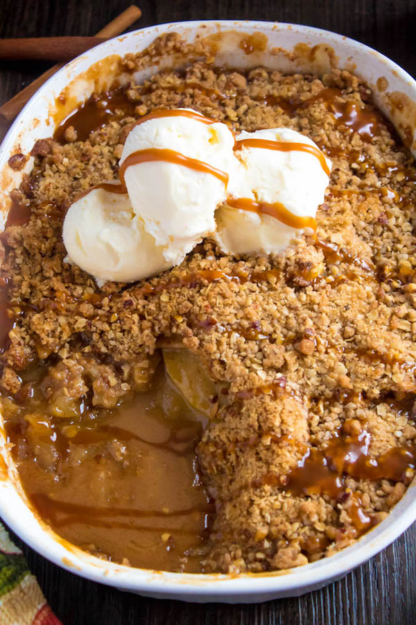 Salted Caramel Apple Crisp – Fresh apples, tossed with sugar and spices, blanketed under a layer of salted caramel sauce and topped with a crispy oatmeal-pecan crumble! This salty and sweet treat is the perfect dessert for Fall and Thanksgiving!