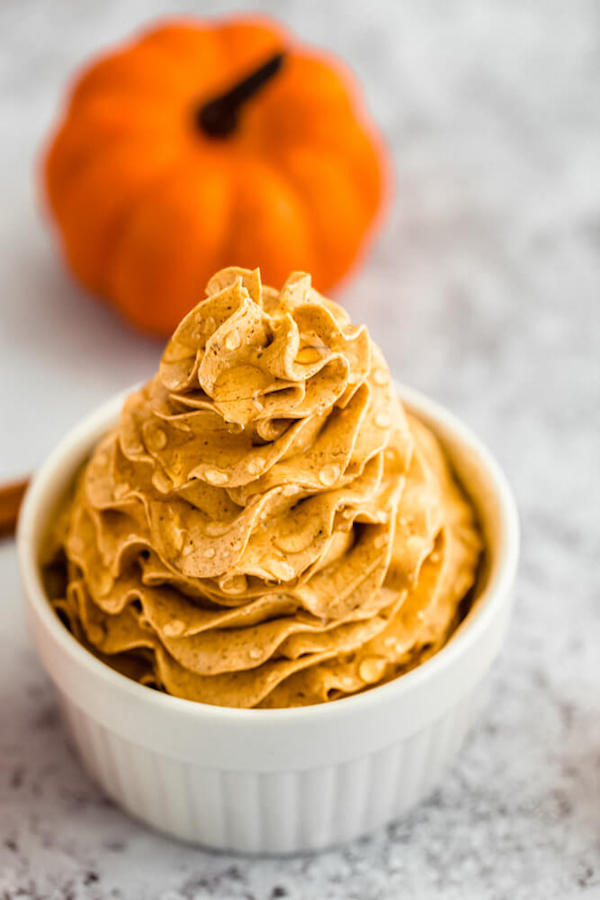 swirl of whipped pumpkin spice honey butter in a ramekin