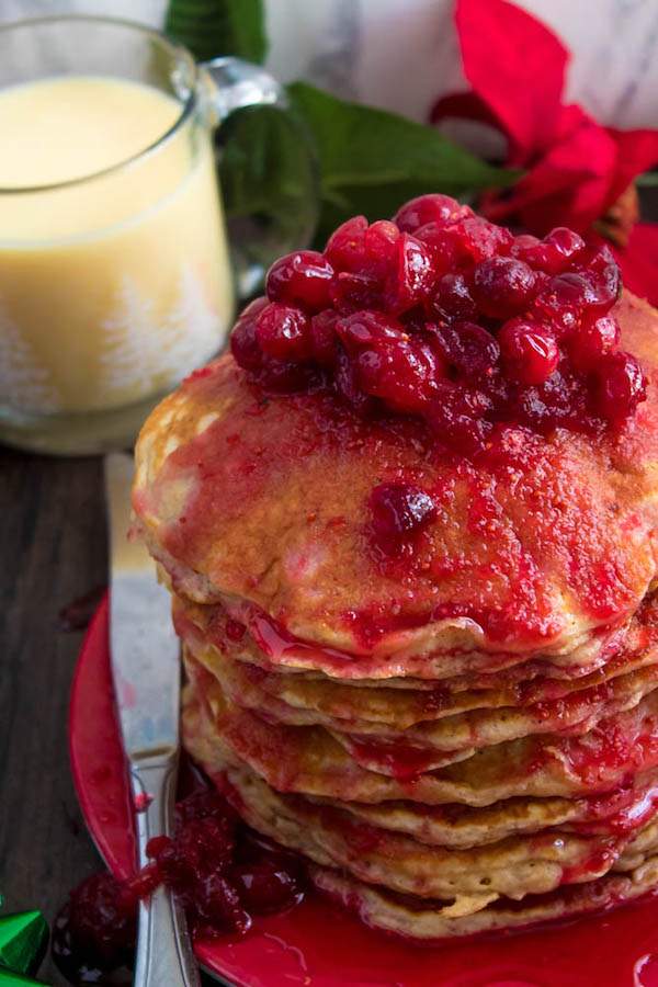 These fluffy, golden Eggnog Pancakes are spiked with rum and have a delicious Eggnog flavour. Top this stack of Christmas flapjacks with fresh cranberry syrup for a delightful holiday breakfast!