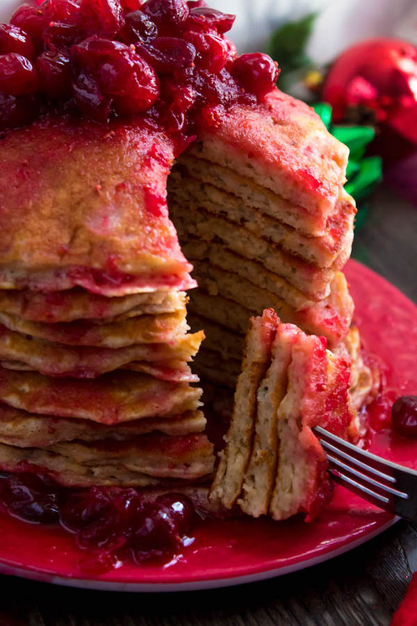 These fluffy, golden Eggnog Pancakes are spiked with rum and have a delicious Eggnog flavour. Top this stack of Christmas flapjacks with fresh cranberry syrup for a delightful holiday breakfast!