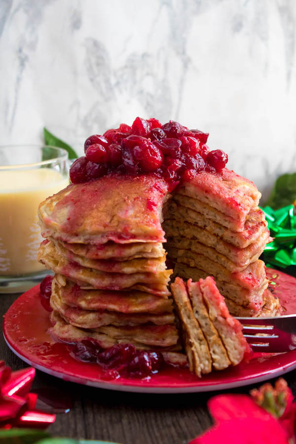 These fluffy, golden Eggnog Pancakes are spiked with rum and have a delicious Eggnog flavour. Top this stack of Christmas flapjacks with fresh cranberry syrup for a delightful holiday breakfast!